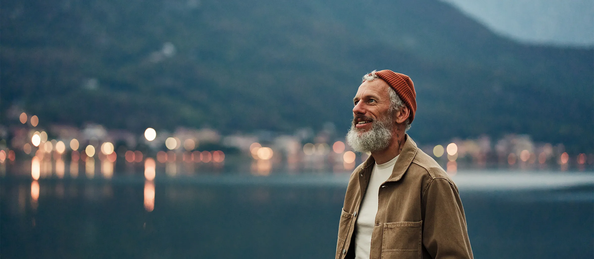 senior man enjoying lake and mountain views