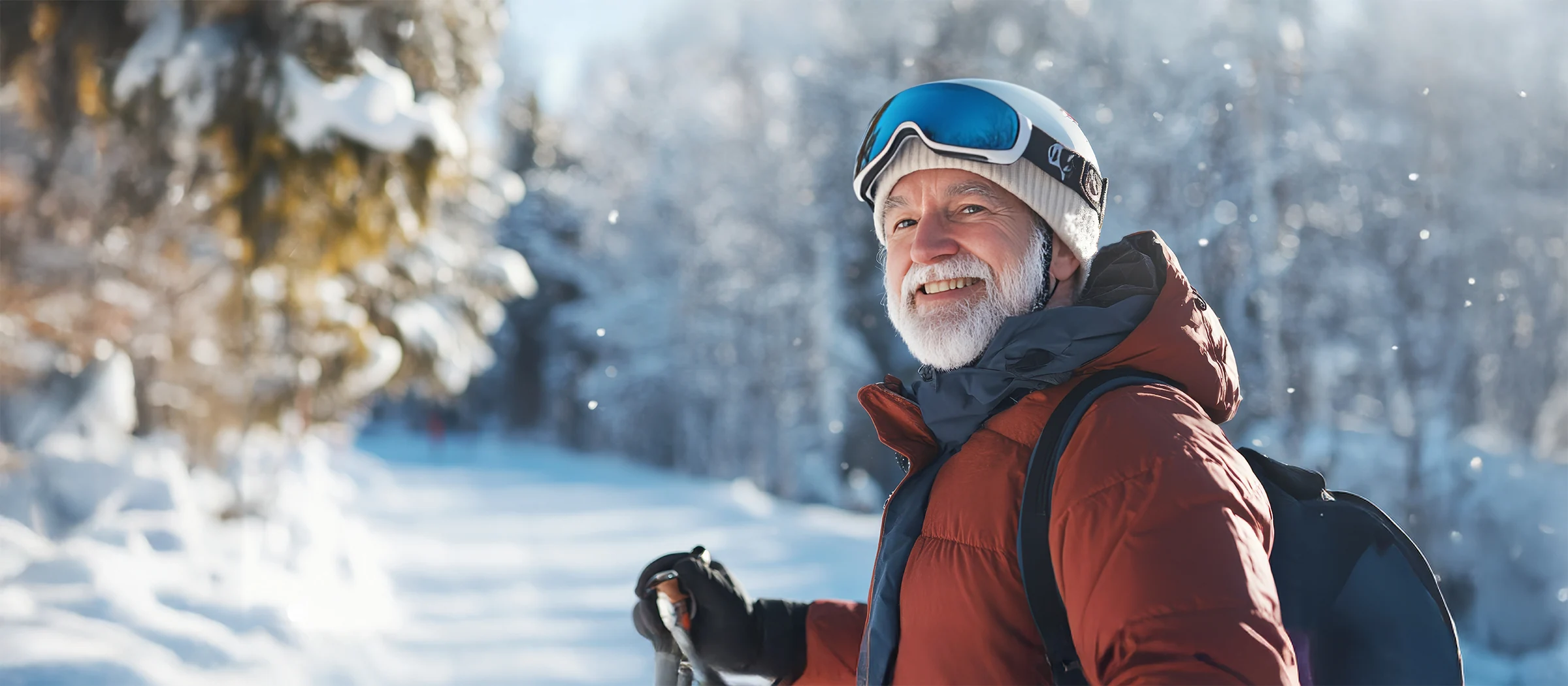 happy senior man enjoying ski trail on snowy day