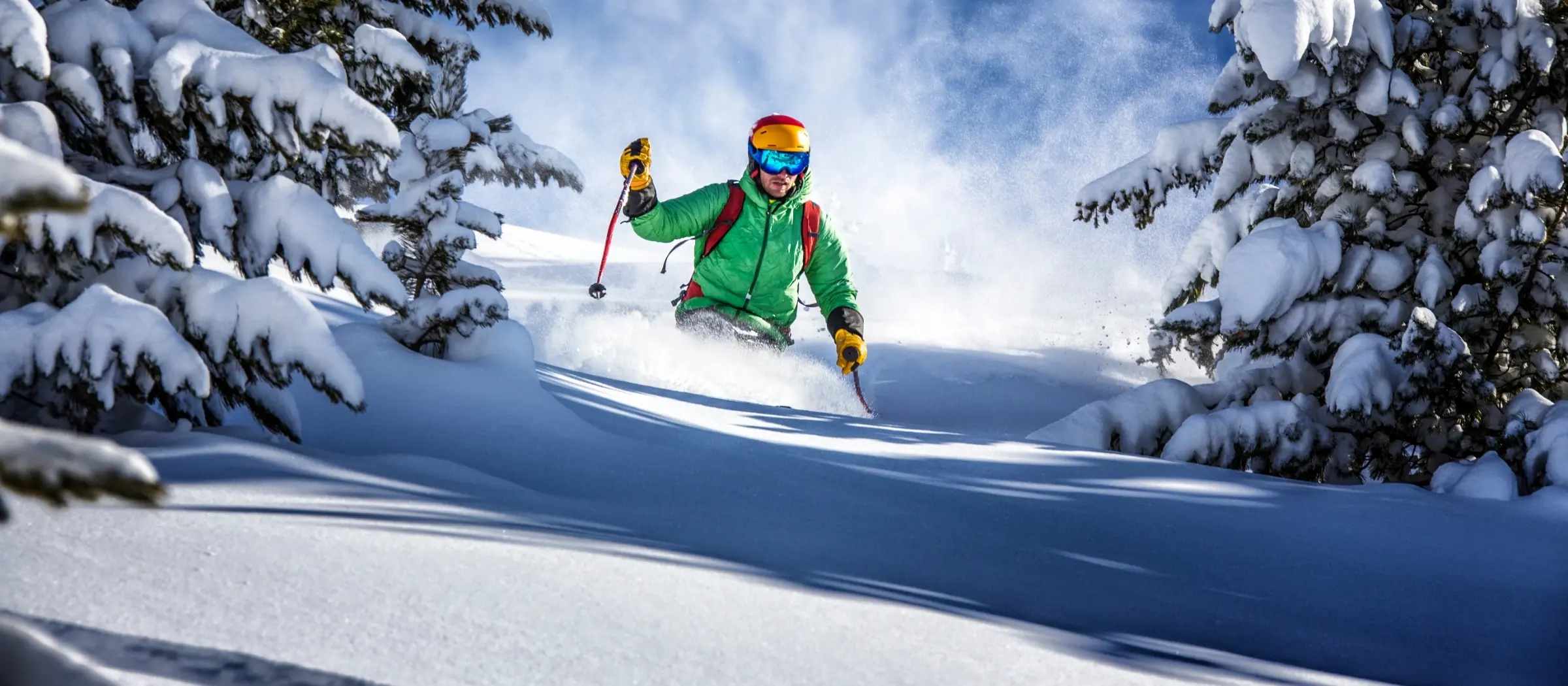 man skiing in powdery snow